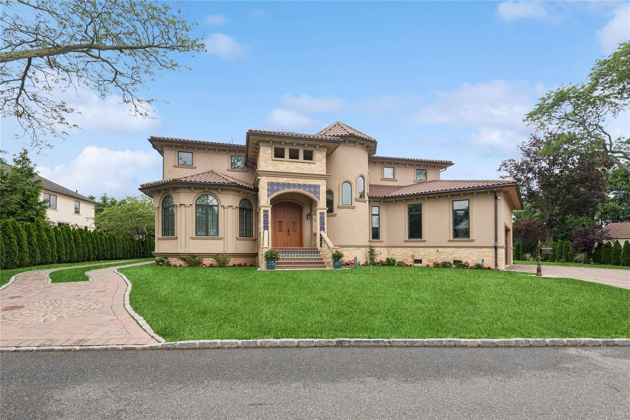 Step into a world of refined elegance at 1190 Harbor Road an architectural triumph nestled in the exclusive enclave of Hewlett Harbor.