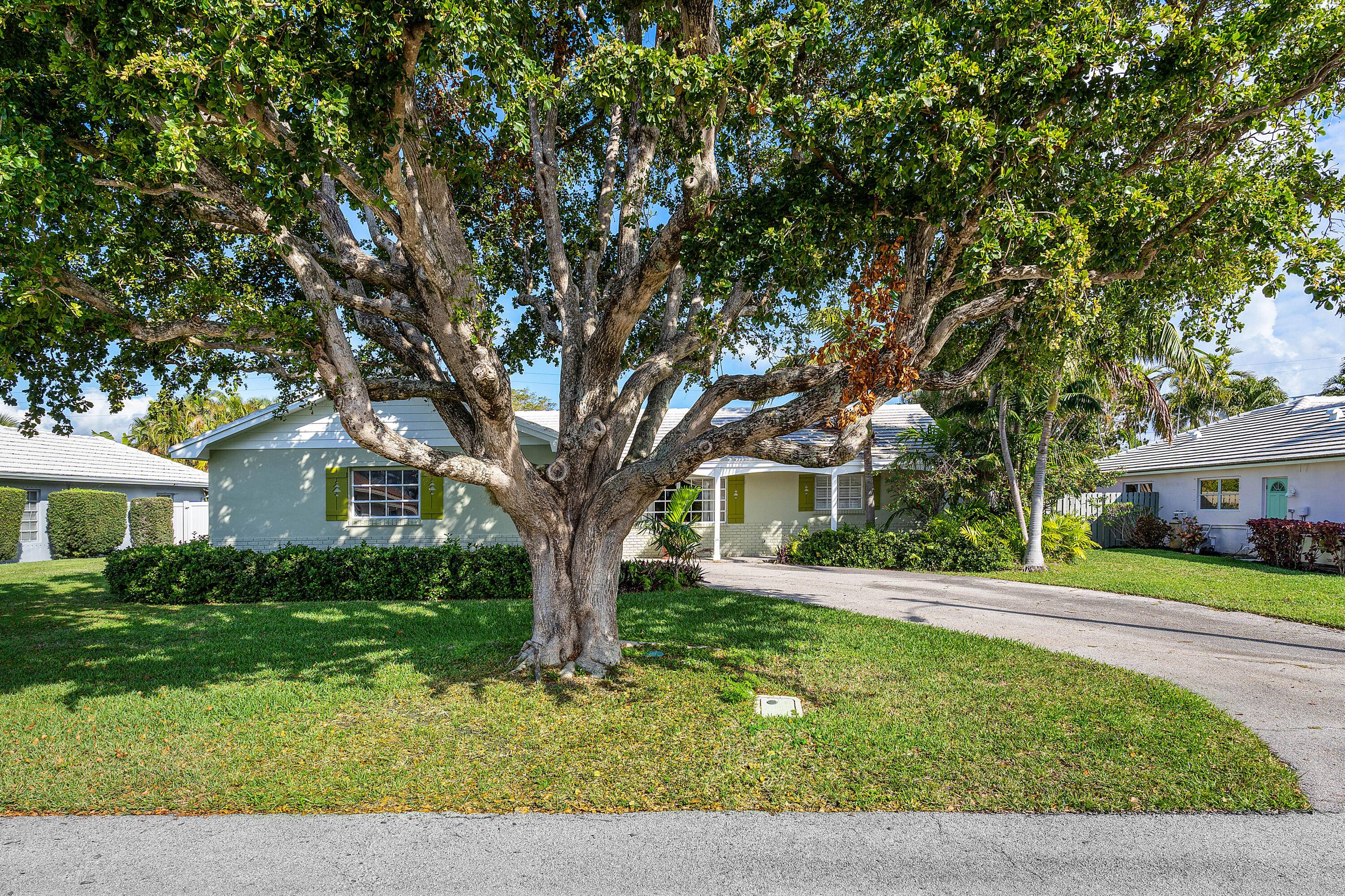 Welcome to 1210 Dolphin Rd, a charming 3 bedroom, 2 bathroom home in the sought after Palm Beach Isles on Singer Island.