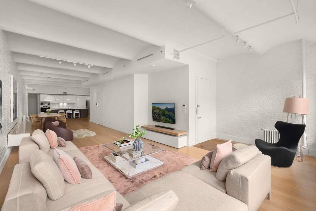 Impeccably Renovated Soho Loft with Timeless Character and Modern Luxury.