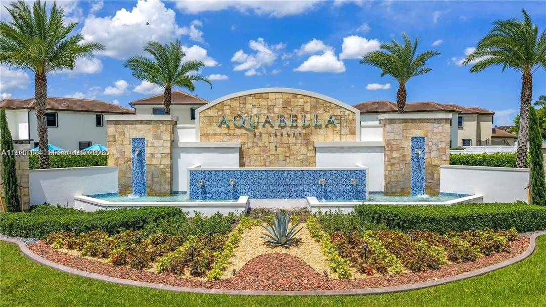 Beautiful lakefront townhouse located in the highly desirable gated community of Aquabella North.