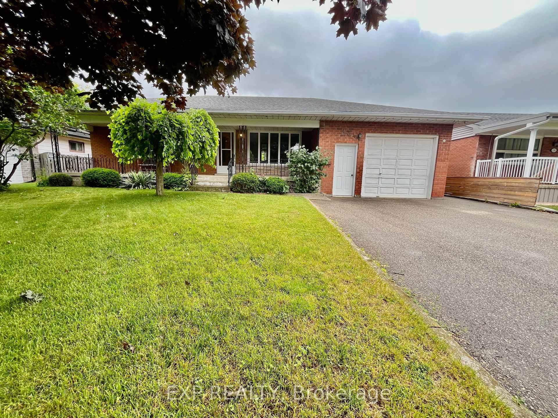 Feel right at home in this comfortable bungalow with 3 bedrooms, 2 kitchens, easy rental situation and an extra long attached garage.