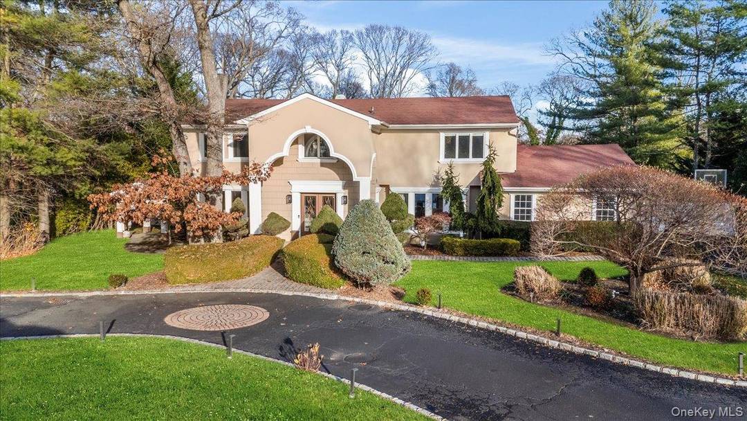 Welcome to 10 Faulkner Lane in Dix Hills an exceptional 5 bedroom, 4.
