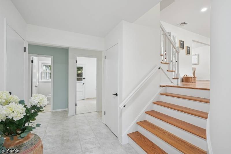 Situated on over an acre and in a highly sought after neighborhood, this beautifully UPDATED 4 bedroom, 2.