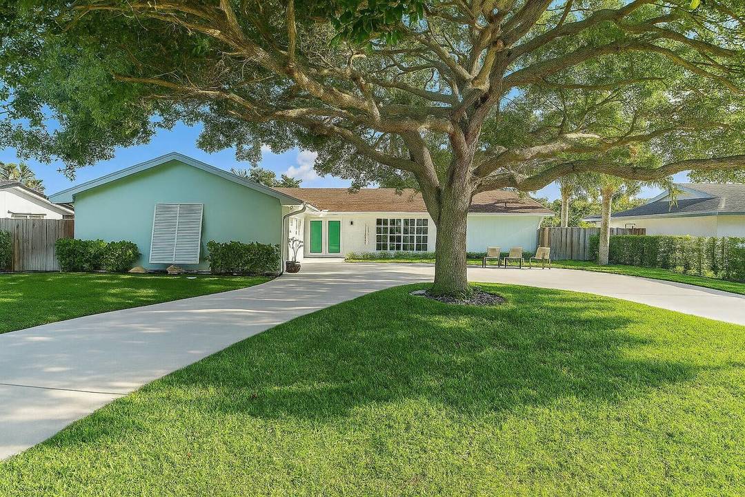 Completely renovated top to bottom with beautiful high end finishes POOL home located within the heart of Palm Beach Gardens with NO HOA !
