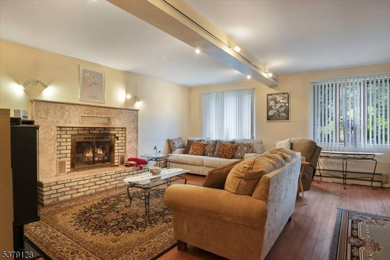Welcome to this beautiful and sun drenched 4 bedroom colonial, perfectly situated on nearly an acre of park like property.