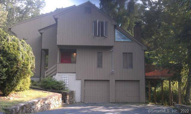 Dramatic Contemporary Colonial with soaring ceilings, hardwood floors, sun drenched large rooms with open floor plan.