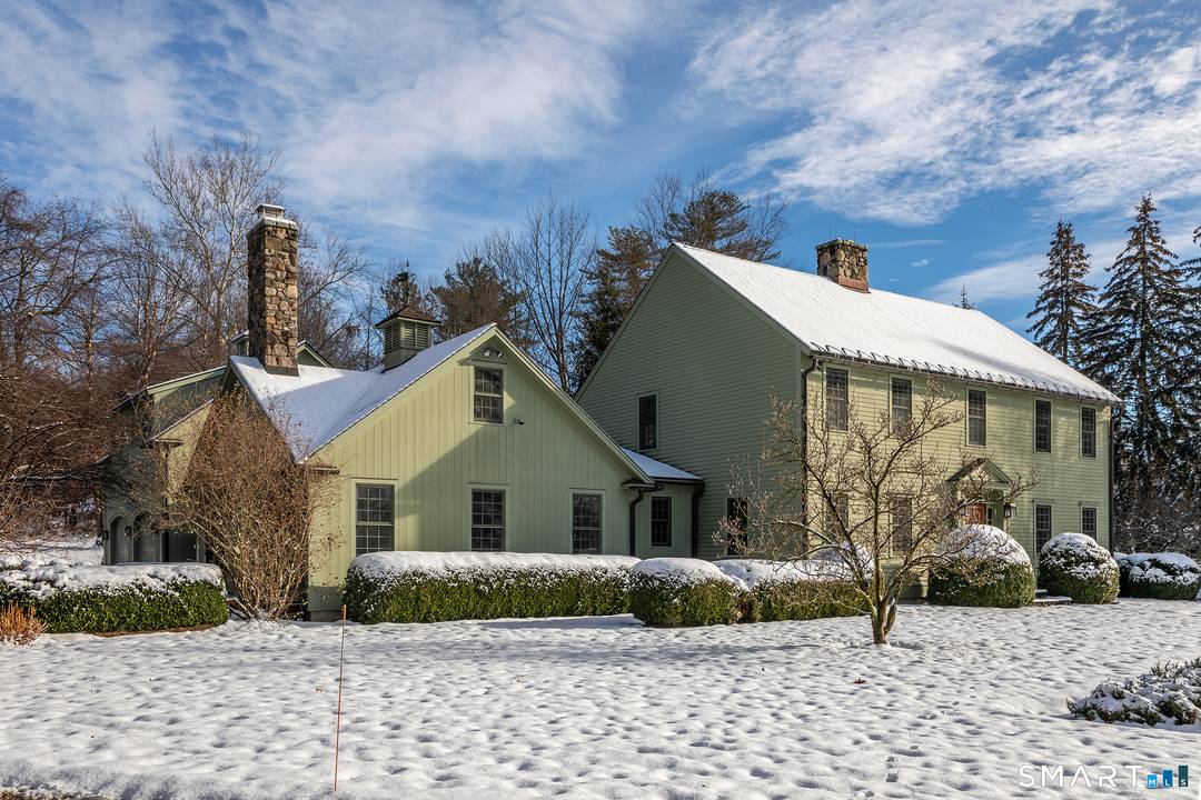 Set back from the road with a sweeping front lawn, this stately Sharon home provides country elegance and privacy in an ideal location.