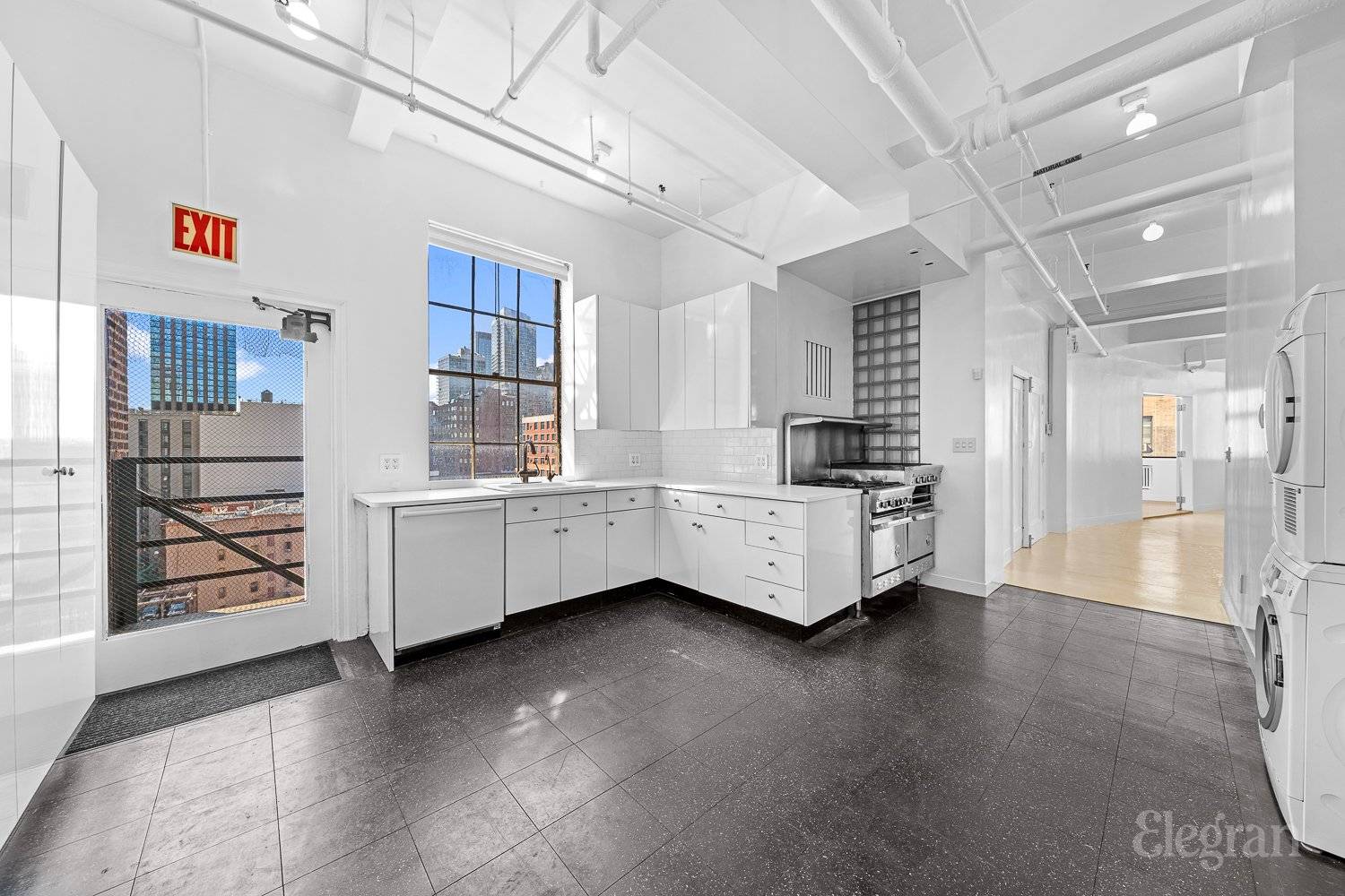 HUGE 5000 SQUARE FEET FULL FLOOR LOFT Stunning grand space with 11 foot beamed ceilings and concrete floor.