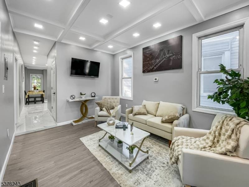 OPPORTUNITY AWAITS ! Ideal for both investors and owner occupants, this expansive two family home highlights quality modern finishes and amenities throughout.