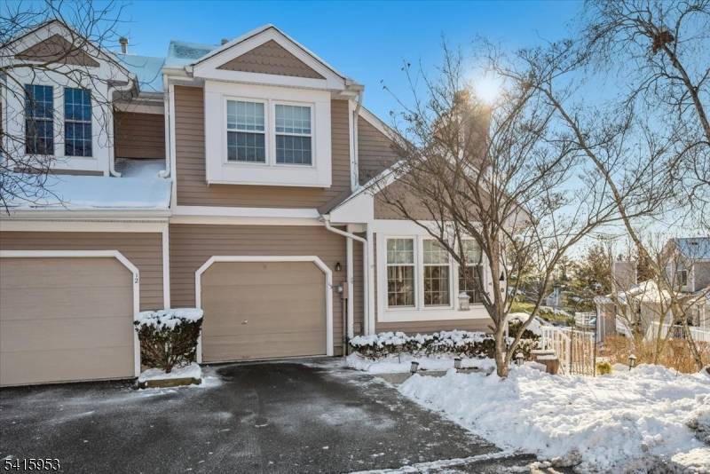 This sun drenched end unit townhouse in the desirable Stone Edge section of The Hills in Bedminster is perfectly situated on a quiet cul de sac with scenic views.