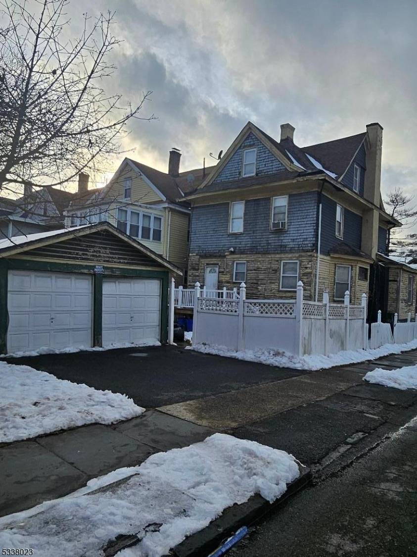 5 bedrooms, 2 bathrooms, living room with fireplace, dining room, kitchen, and full basement.