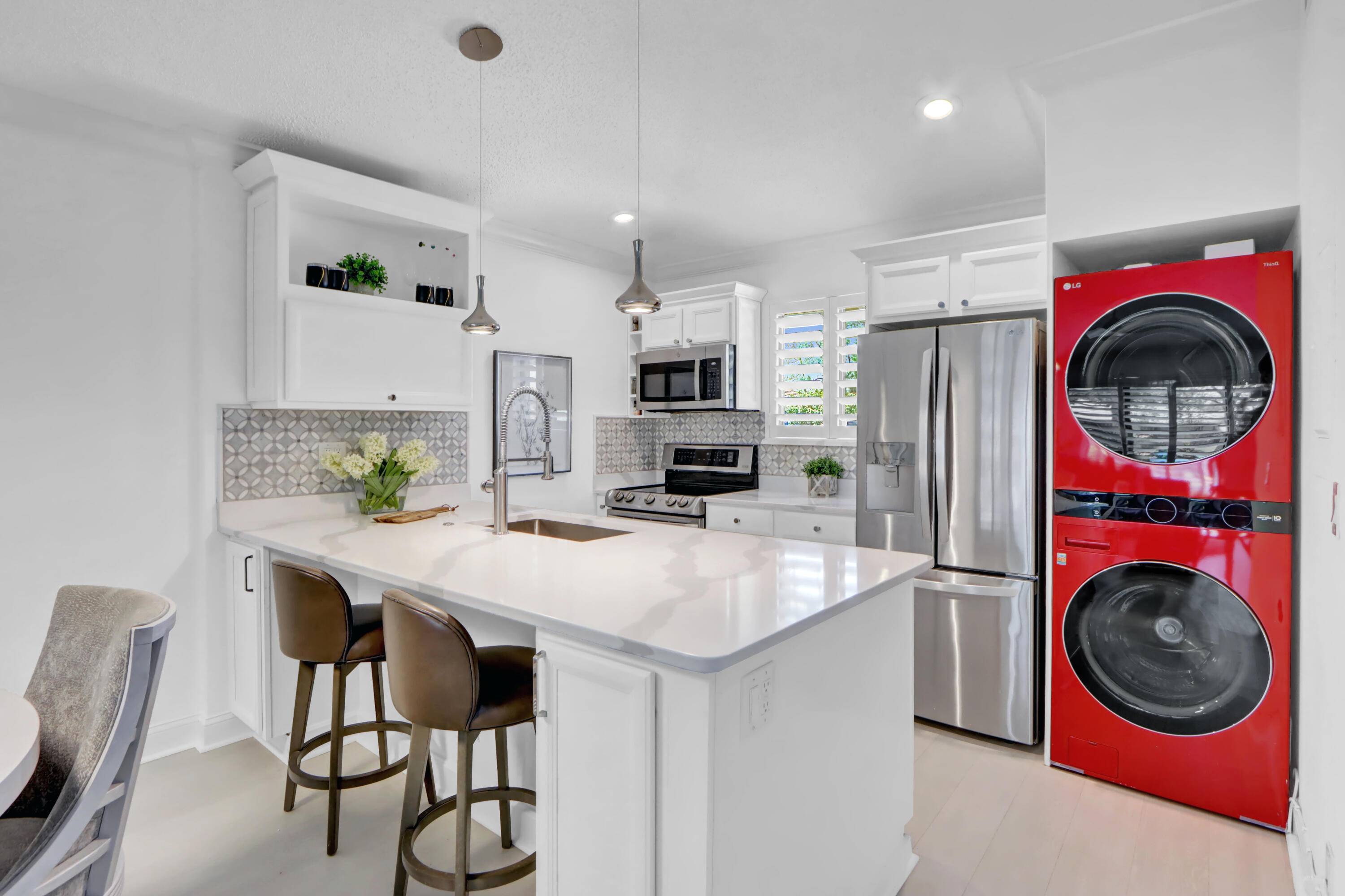 SOLD TURNKEY ! Experience luxury redefined in this totally renovated 2 bed, 2 bath villa located within the prestigious PGA National Golf Club.