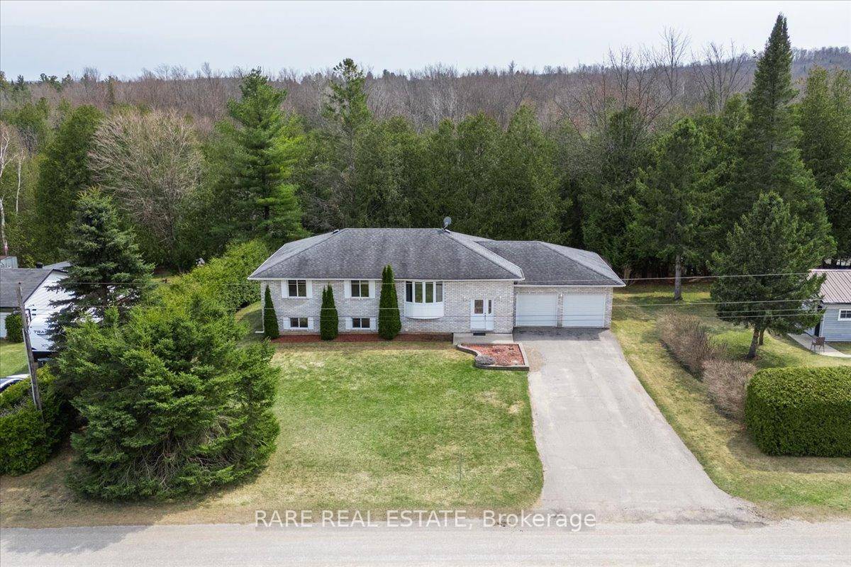 Discover the perfect blend of nature, comfort, and convenience in this meticulously maintained all brick raised bungalow, offering over 2, 800 finished sq.