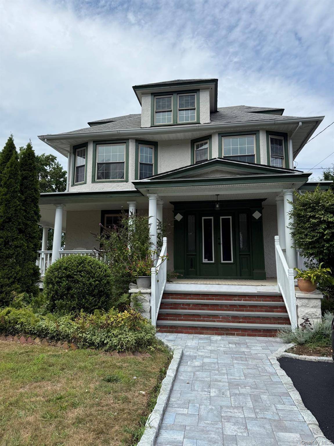 Welcome to this beautifully renovated 1918 Colonial, blending timeless charm with modern updates.
