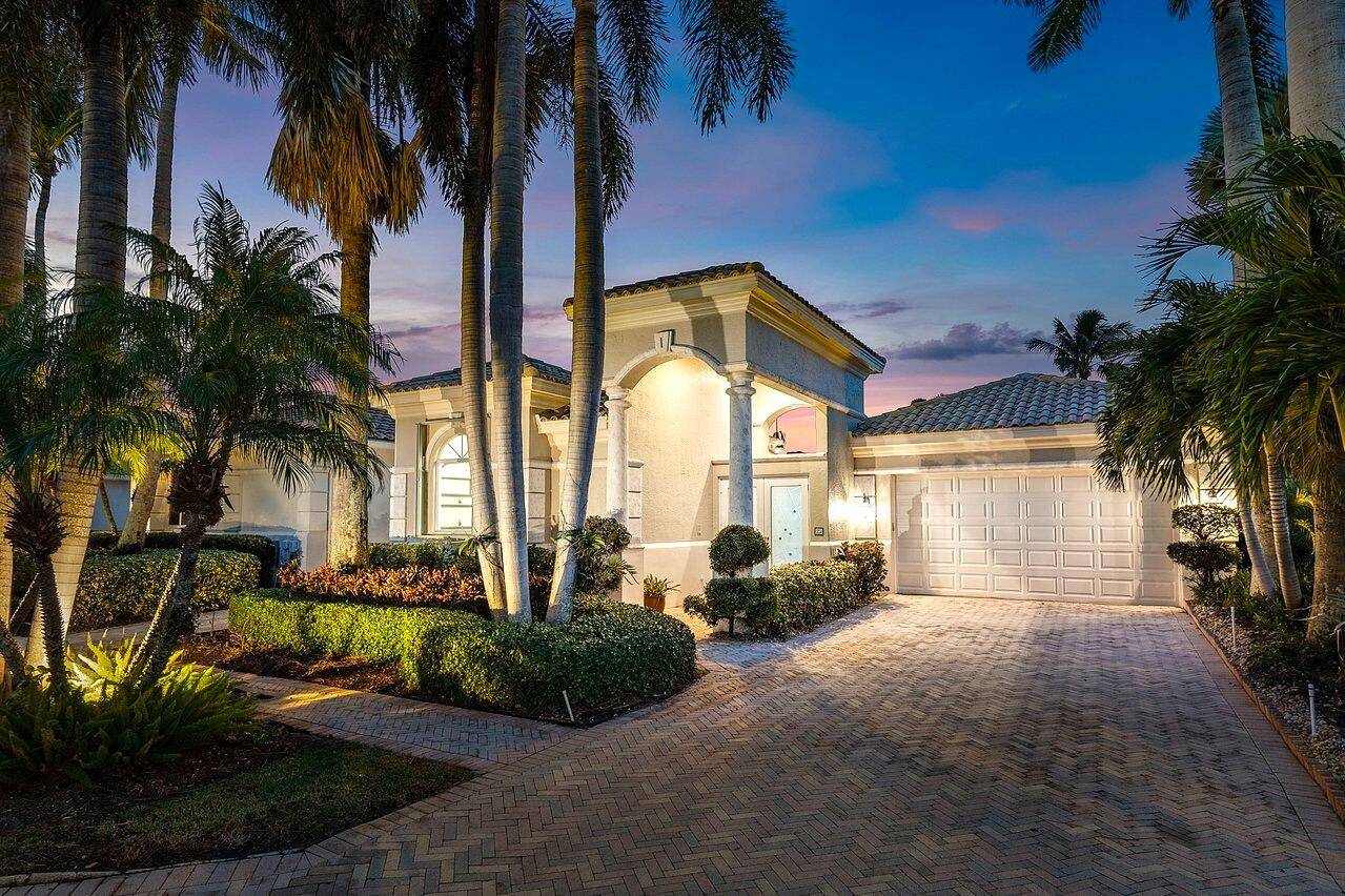 Nestled in the exclusive Isles at Hunters Run Country Club, this enchanting 4BR courtyard presents a private paradise that delights at every turn.