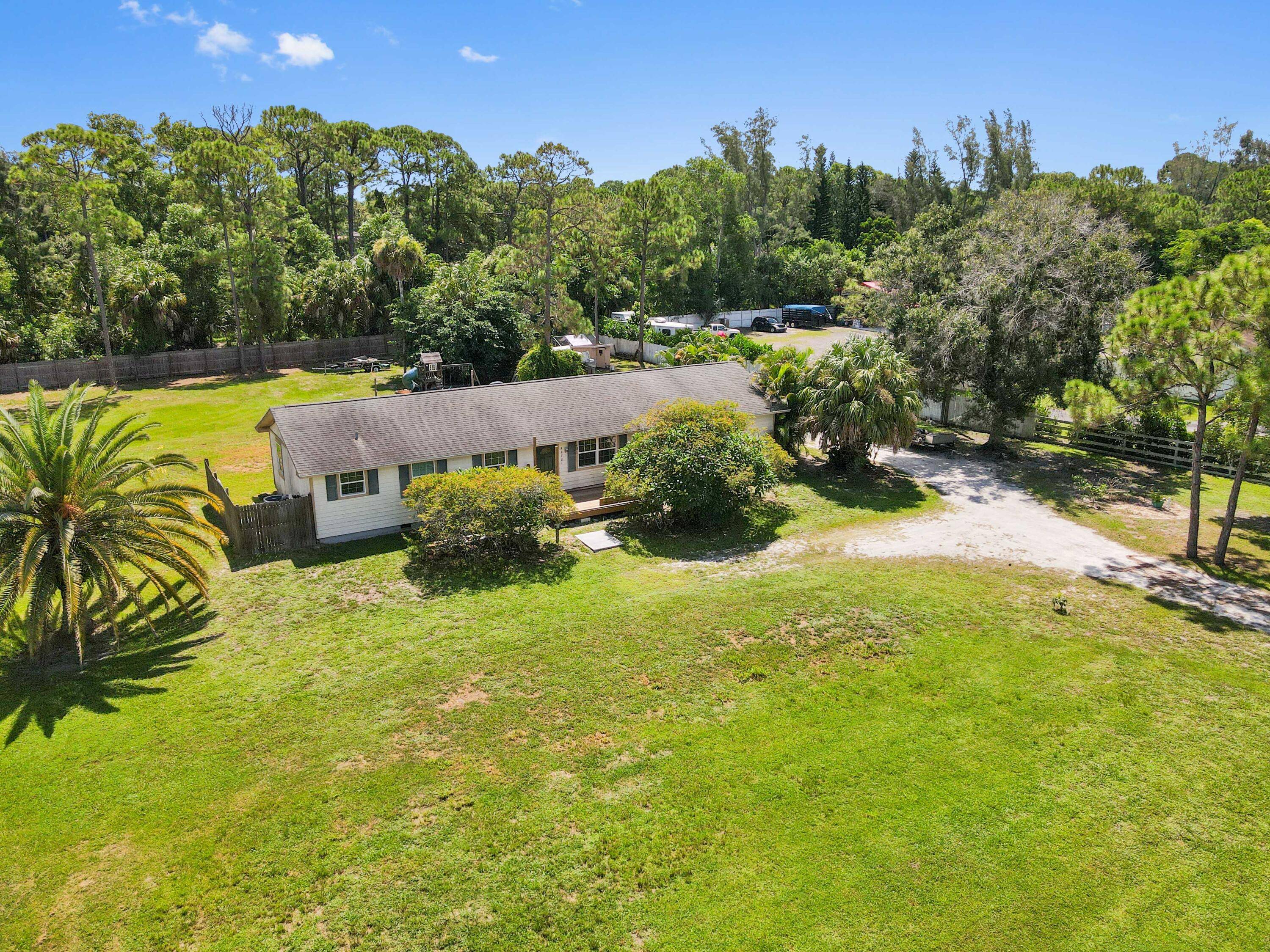 Discover your piece of paradise in this light, bright, and charming 3 bedroom, 2 bathroom home, perfectly situated on a massive, oversized 1.