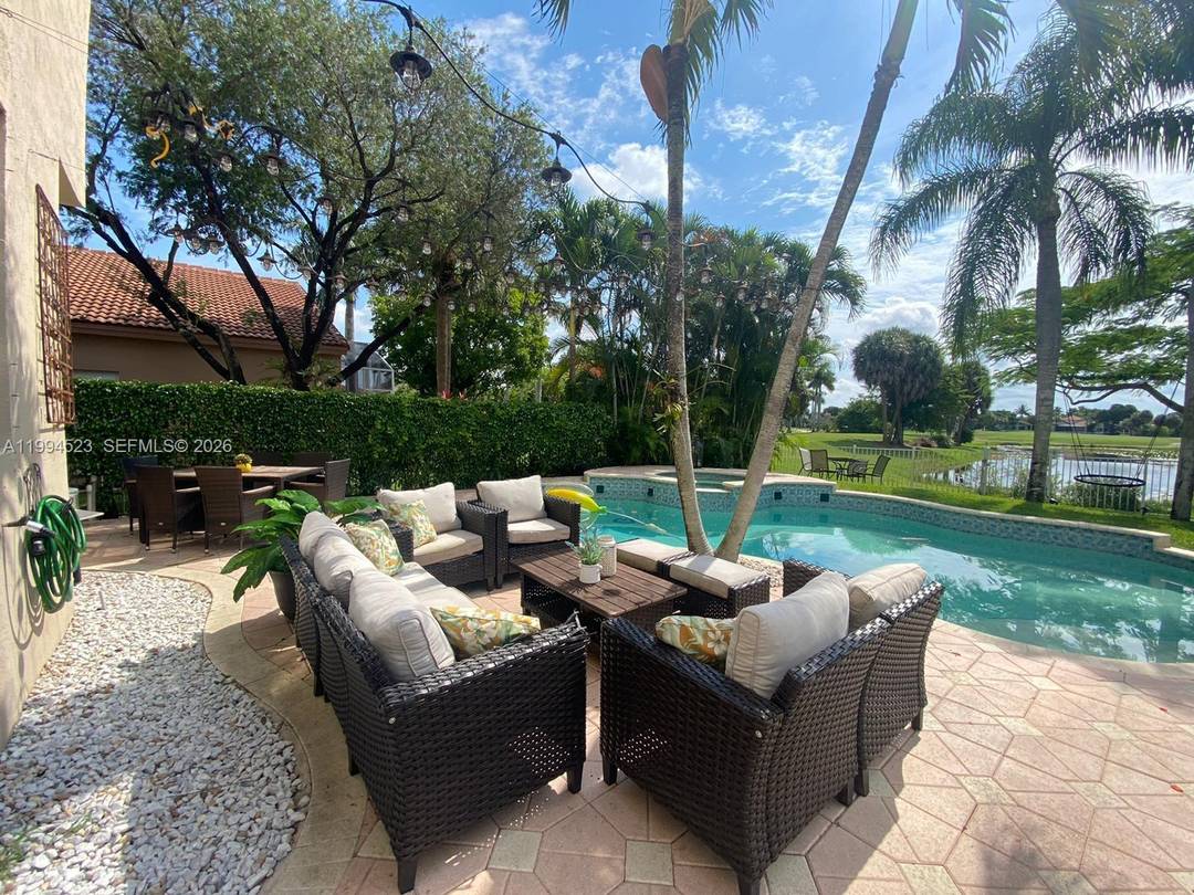 Beautiful, completely updated waterfront two story home offering 4 bedrooms and 3 full bathrooms in the prestigious Grand Palms Golf Community.