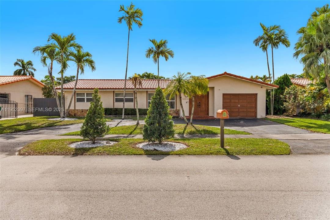 13210 SW 21st St Beautifully updated home featuring a modern kitchen, remodeled bathrooms, brand new AC, new floors throughout, and a private swimming pool.