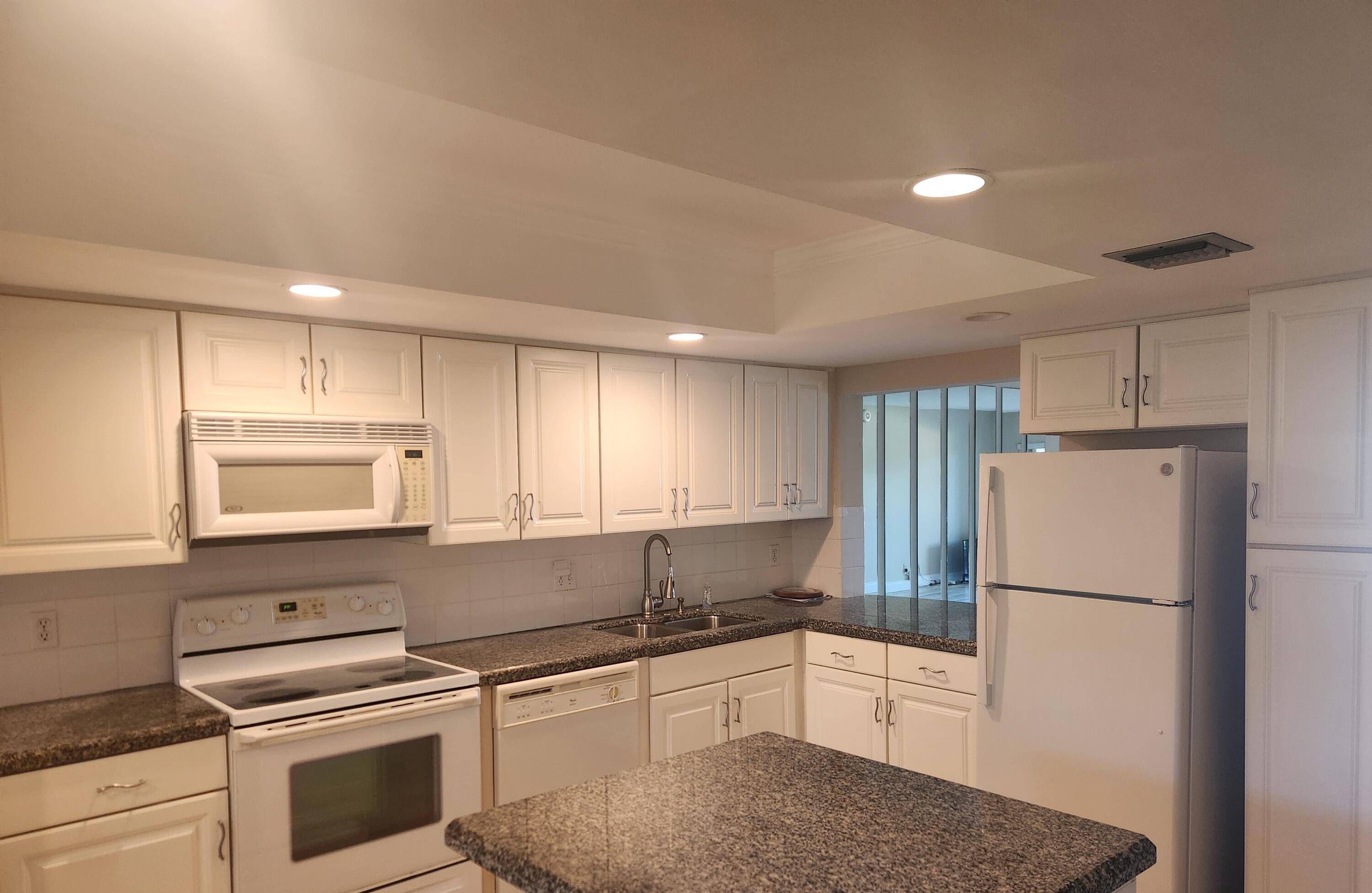 Discover coastal living at its finest in this beautifully renovated condo, perfectly situated near the Intracoastal Waterway and Safe Harbor Marina.
