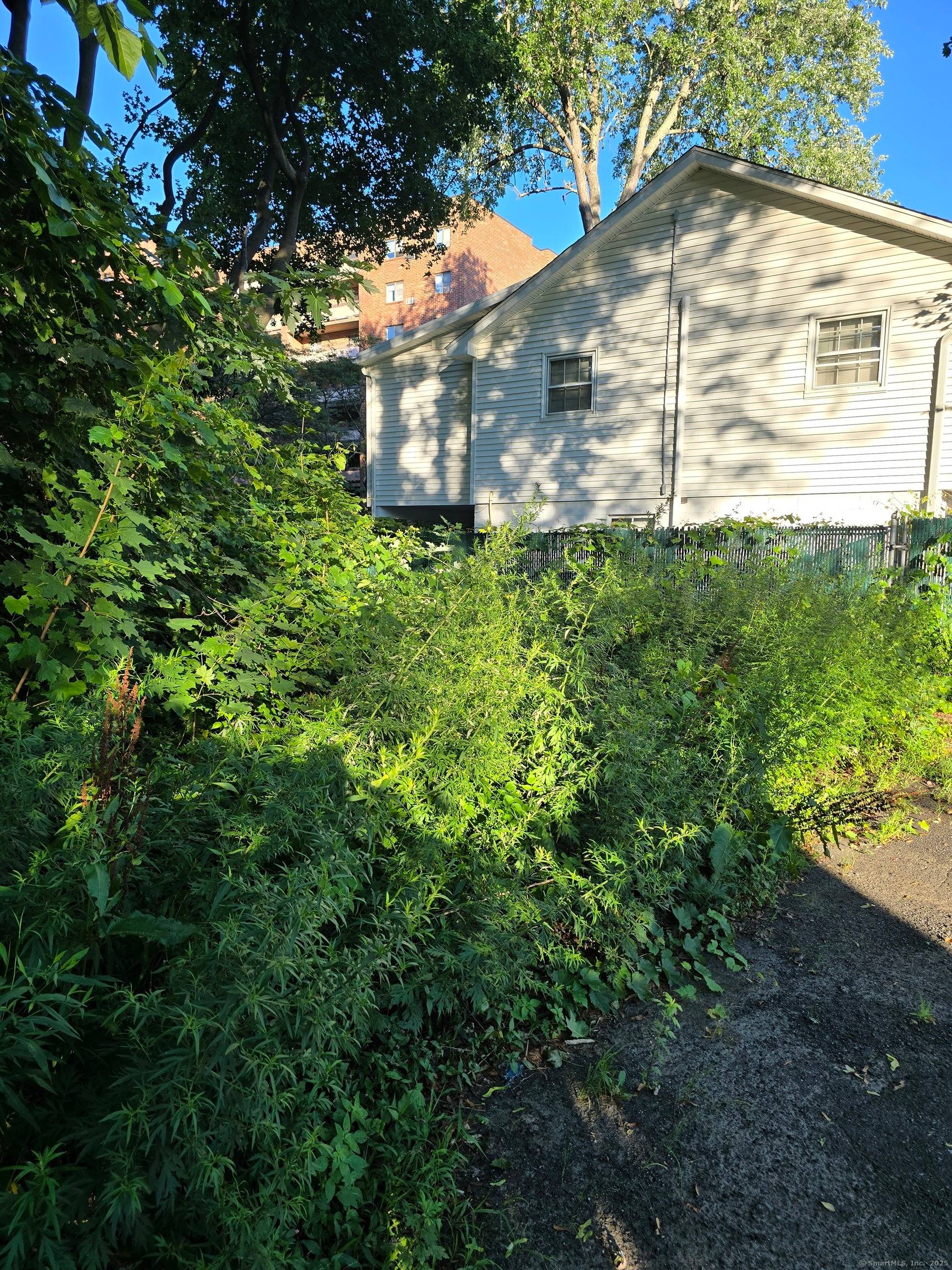 This lot will be sold with 59 Main Street office building.