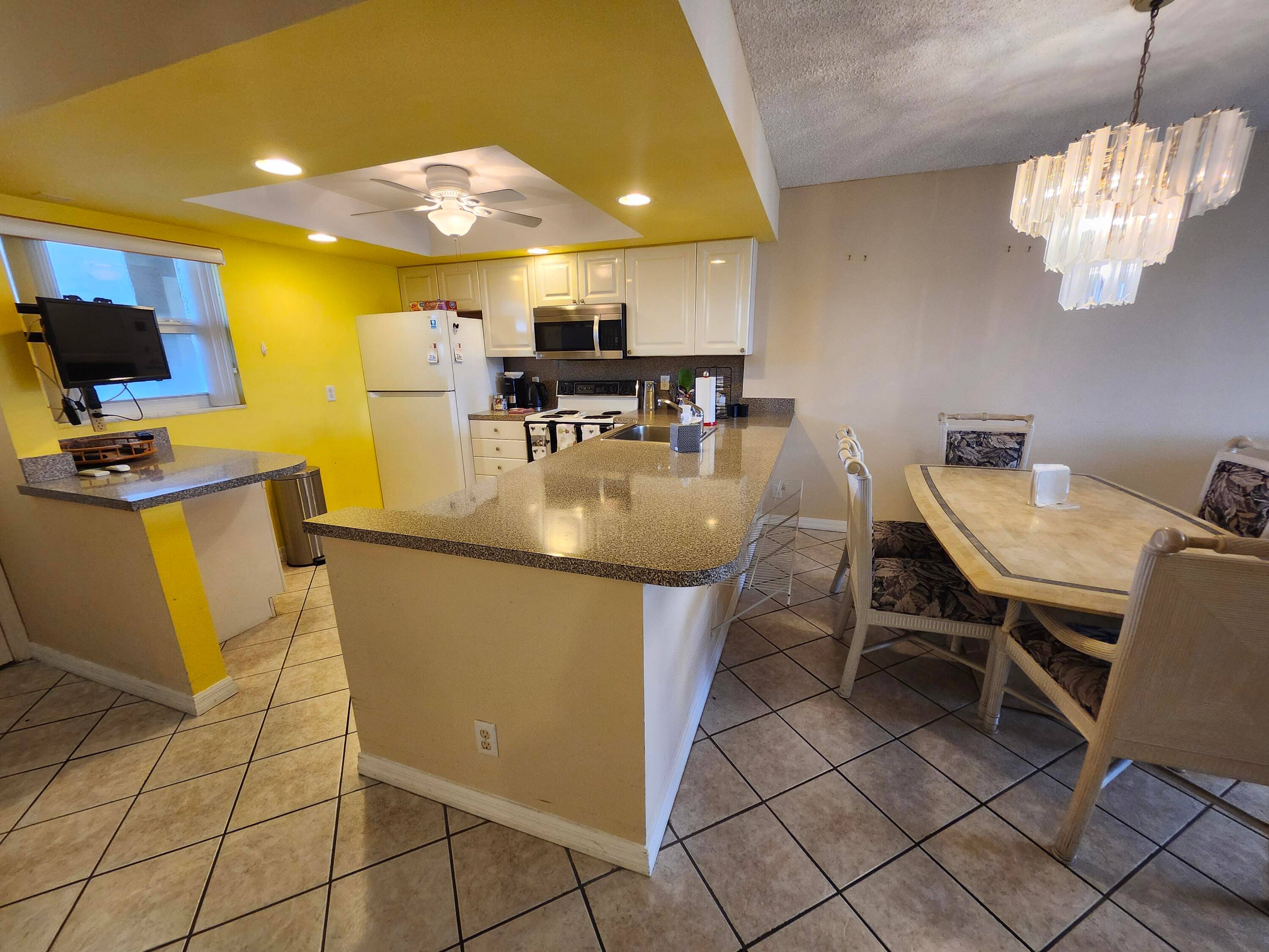 2 2 Furnished Turnkey optional has a beautiful Garden view from Florida Room w Impact windows ceiling fan.