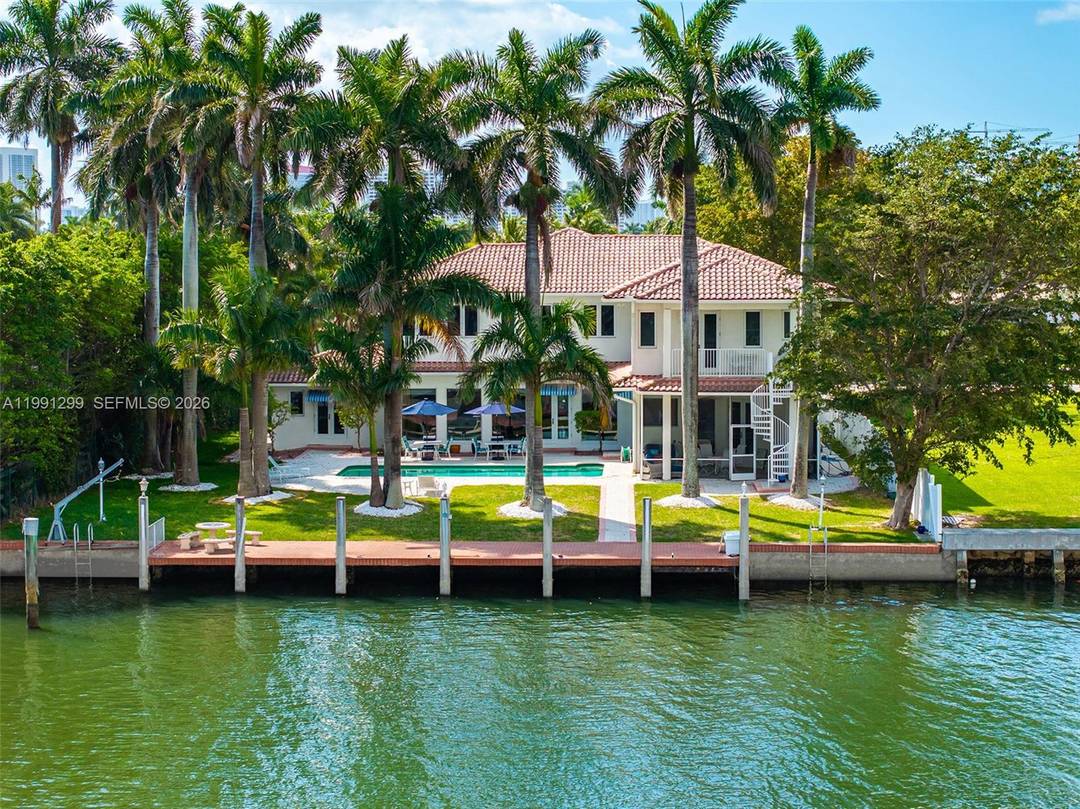 Two story waterfront property in Hollywood Lakes featuring 100 feet of waterfront on an expansive 100 x 234 lot.