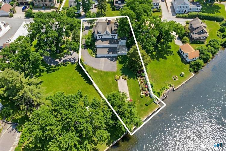 Steeped in history and prominently positioned in the heart of Essex Village, the distinguished Frederick Scholes House circa 1890 offers a rare opportunity to own a landmark waterfront estate.