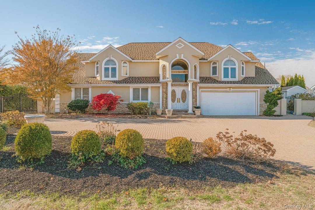 Welcome to a rare waterfront trophy property tucked away on a private street in one of West Islip s most coveted locations.