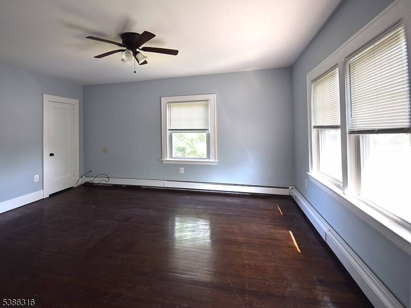 Well maintained three family half brick home on an oversized corner lot with strong rental potential.