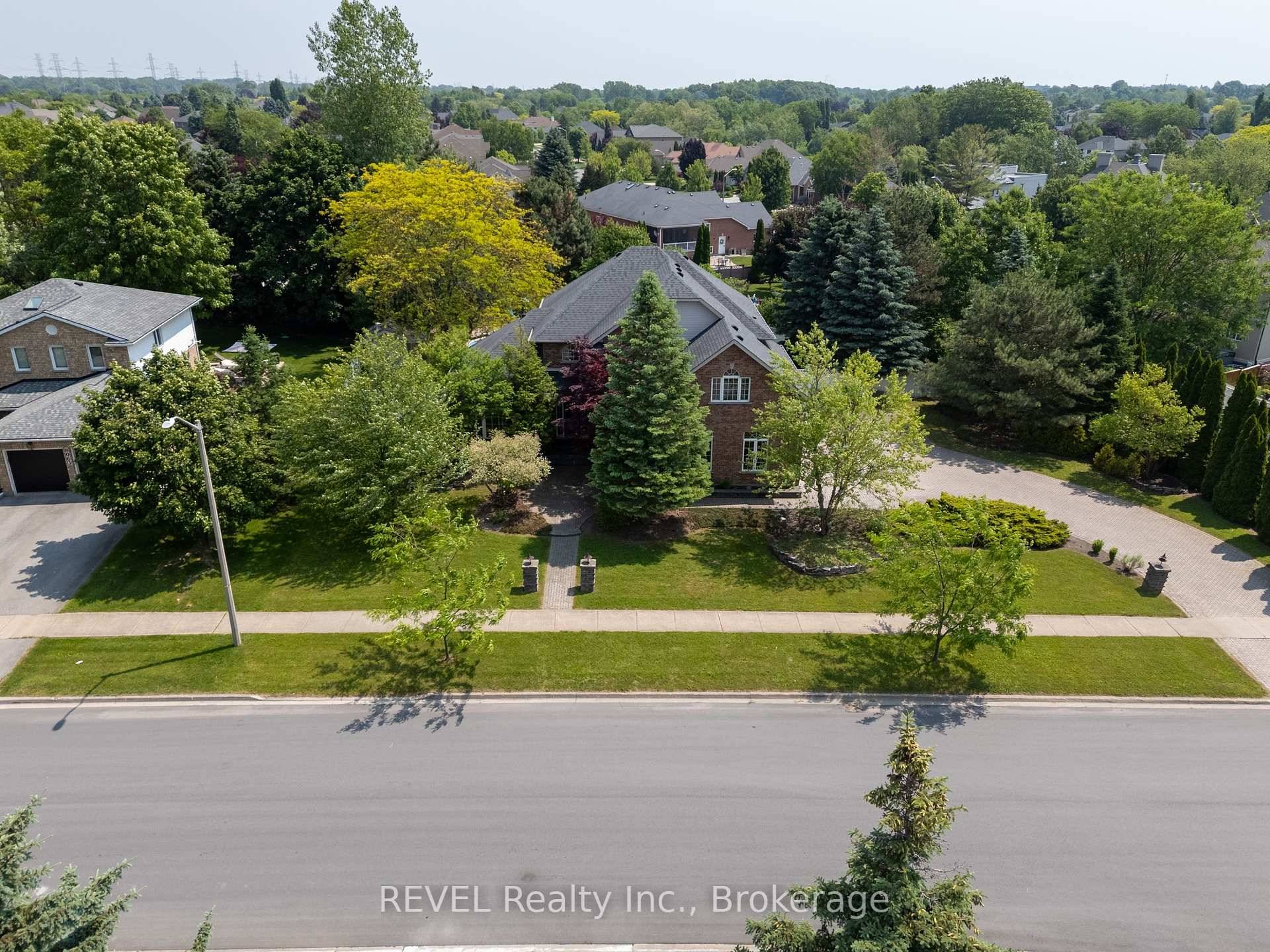 Welcome to this custom built 2 storey brick home nestled among mature trees in the heart of Mount Carmel one of Niagara Falls most sought after neighbourhoods.