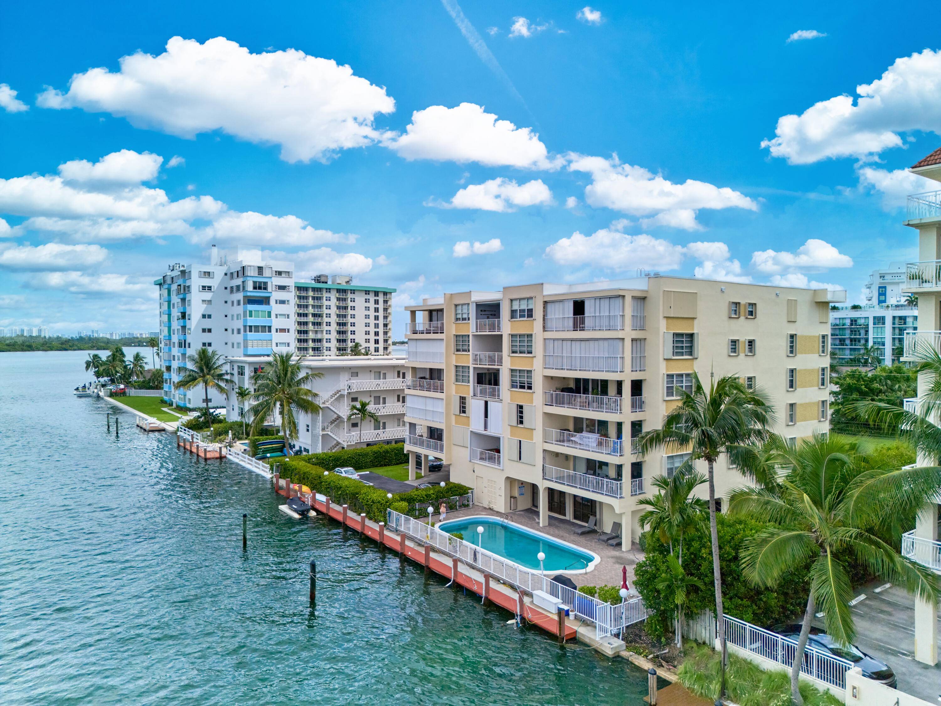 Welcome to 10180 W Bay Harbor Drive, a stunning 2 bed, 2.