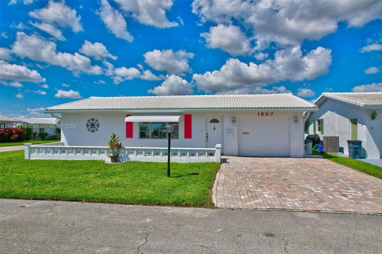 Unique Challenger Home on a corner lot with brand new roof May 2024 and a porch.