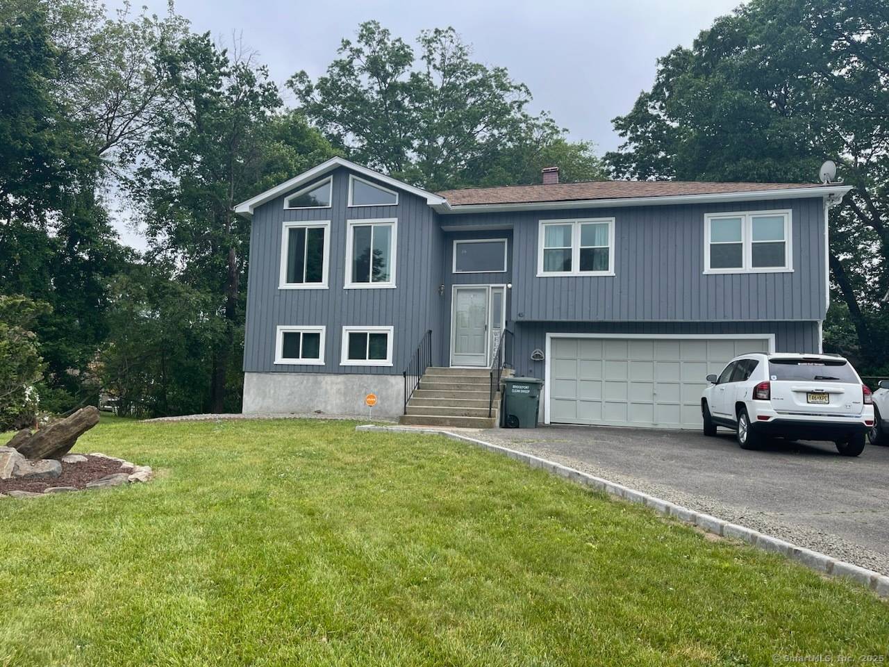 Welcome to this beautiful family home nestled on a quiet cul de sac in Bridgeport's desirable North End neighborhood, known for its peaceful atmosphere and friendly community.