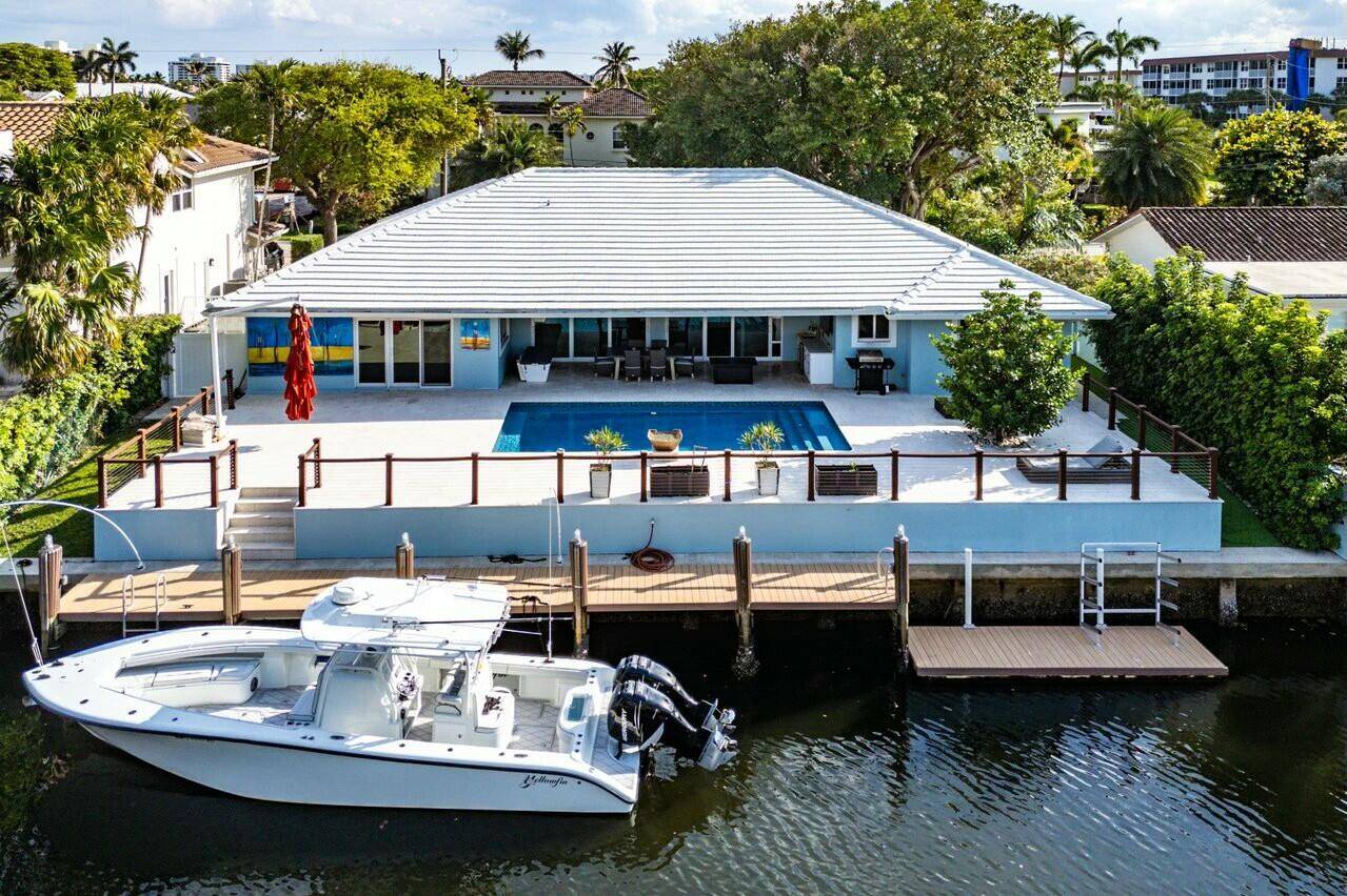 A rare opportunity to own a stunning single story waterfront residence in the prestigious enclave of Tropical Isles.