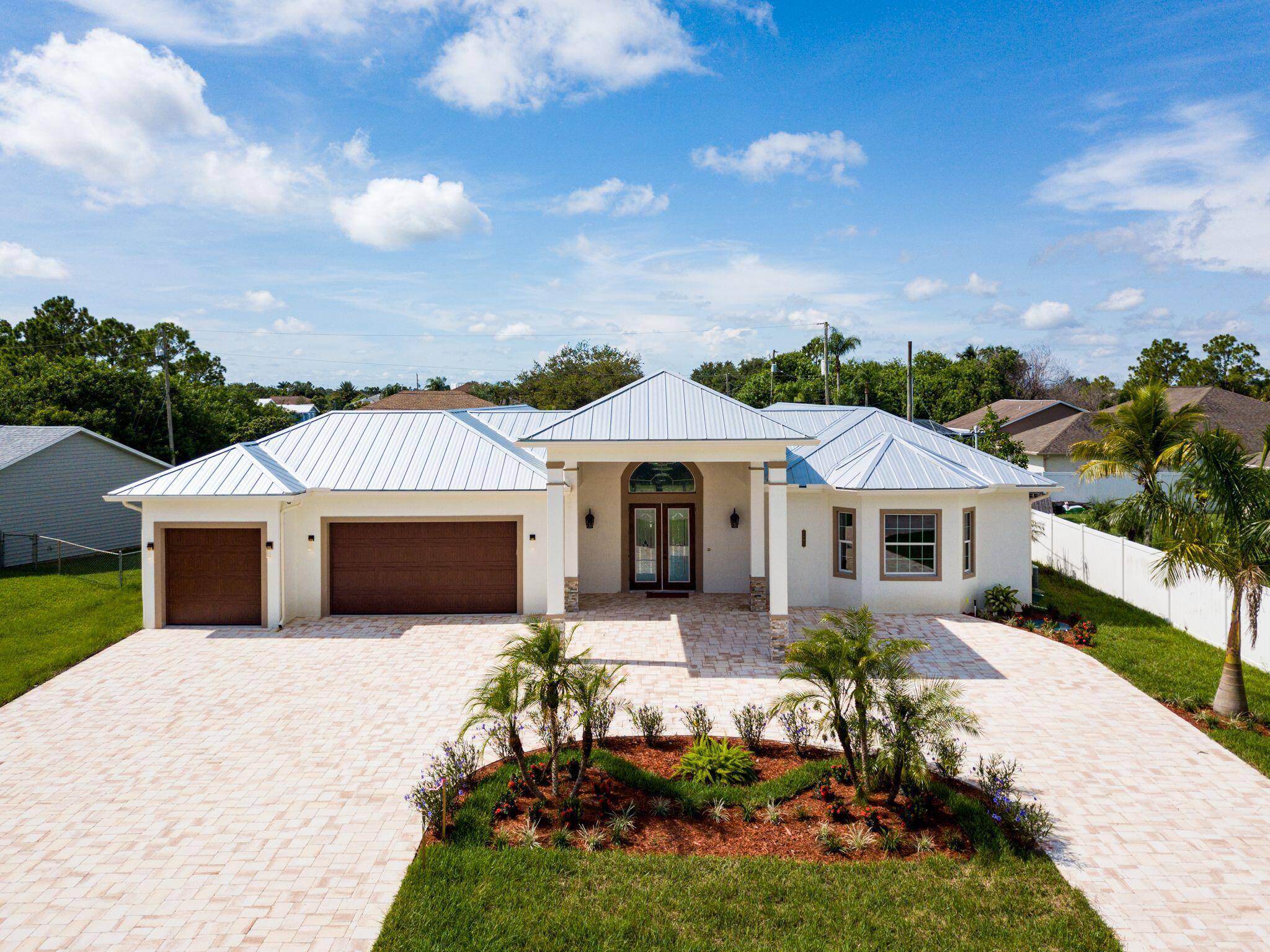 Mint condition ! 3, 444 sq ft custom built 2019 Builder's home with a unique floorplan, Porcelain tile floors and 14' volume Ceilings.