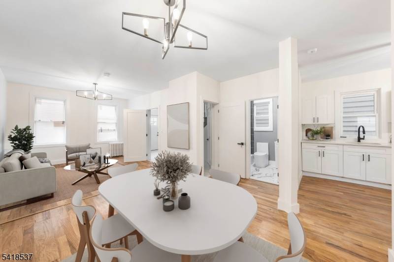 This renovated two family home features modern, cozy styling with two 3 bedroom units, making it ideal for comfortable living or investment.