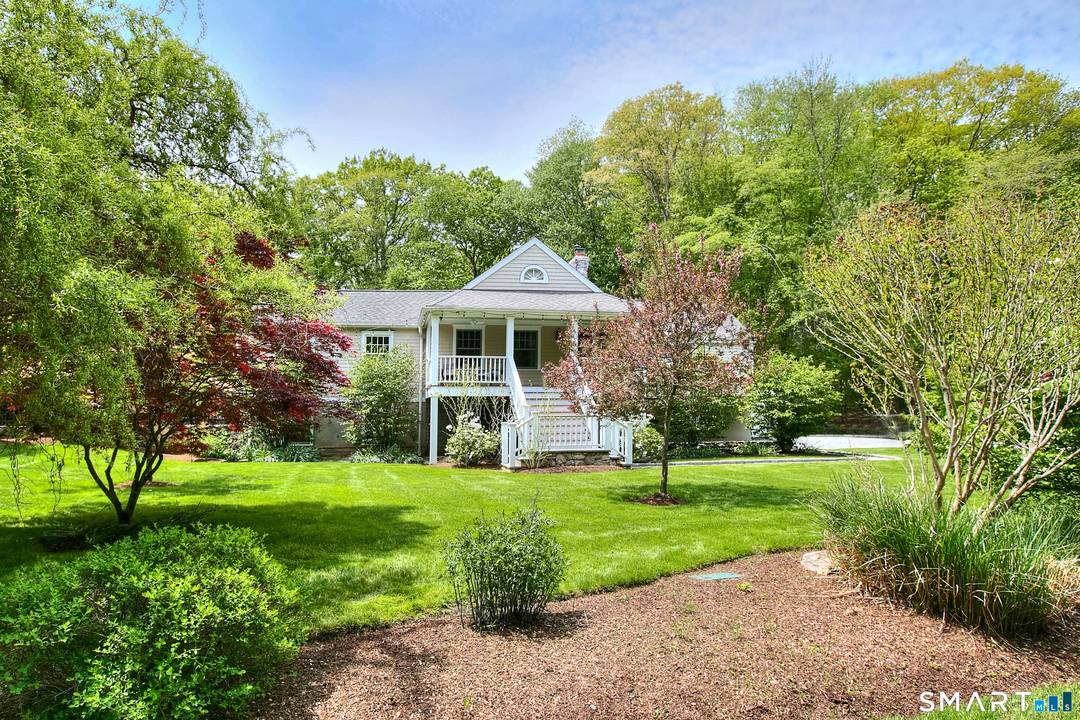 Set on a quiet, convenient street in Westport's coveted Old Hill, this charming home captures the essence of Fairfield County living.