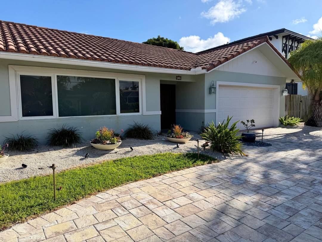 This charming waterfront single family home sits on a generous.