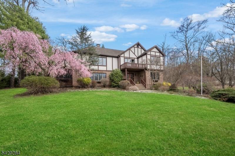 Set back from the street, this impressive High Ridge Colonial offers privacy, space, and extensive upgrades on over an acre.