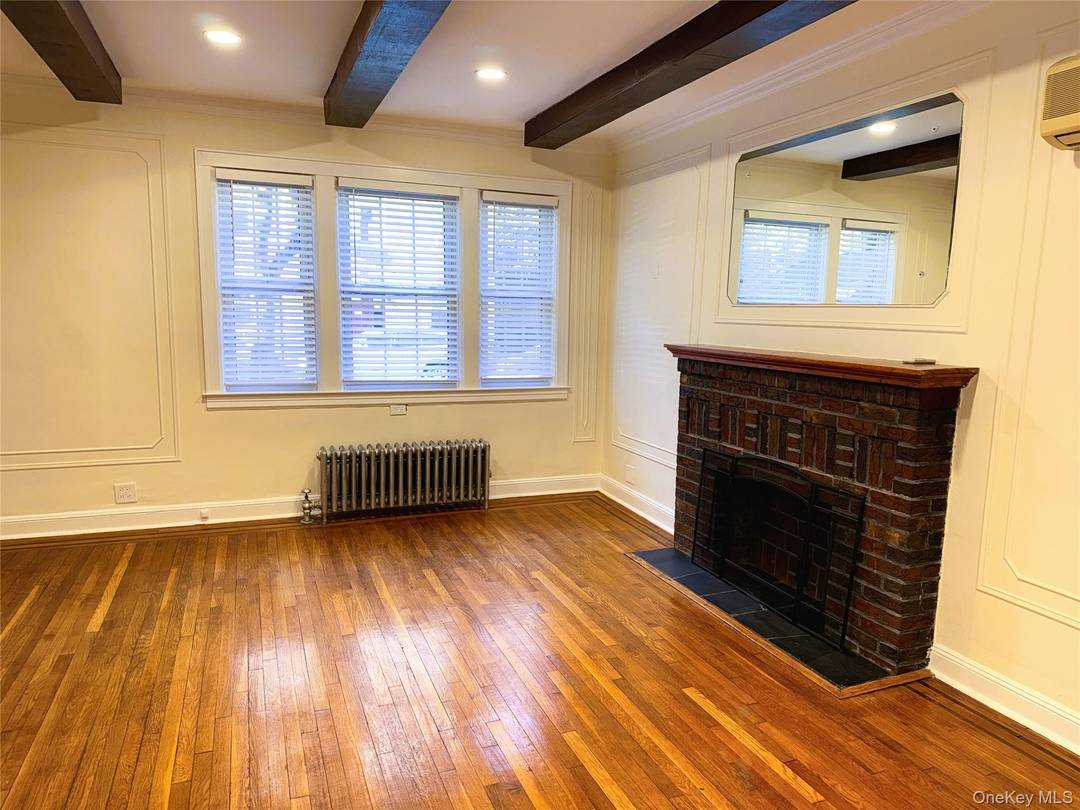 Located on the Sunnyside Woodside border, this spacious first floor, 2 bedroom flex 3 bedroom apartment in a two family home is a must see and will not last !