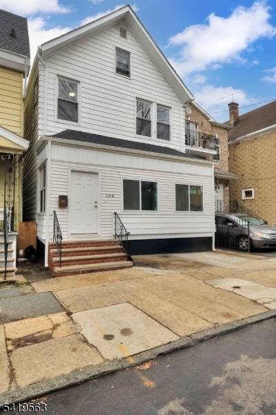 Welcome to 106 S 11th St, Newark a spacious home offering impressive proportions, high ceilings, and a layout full of potential.
