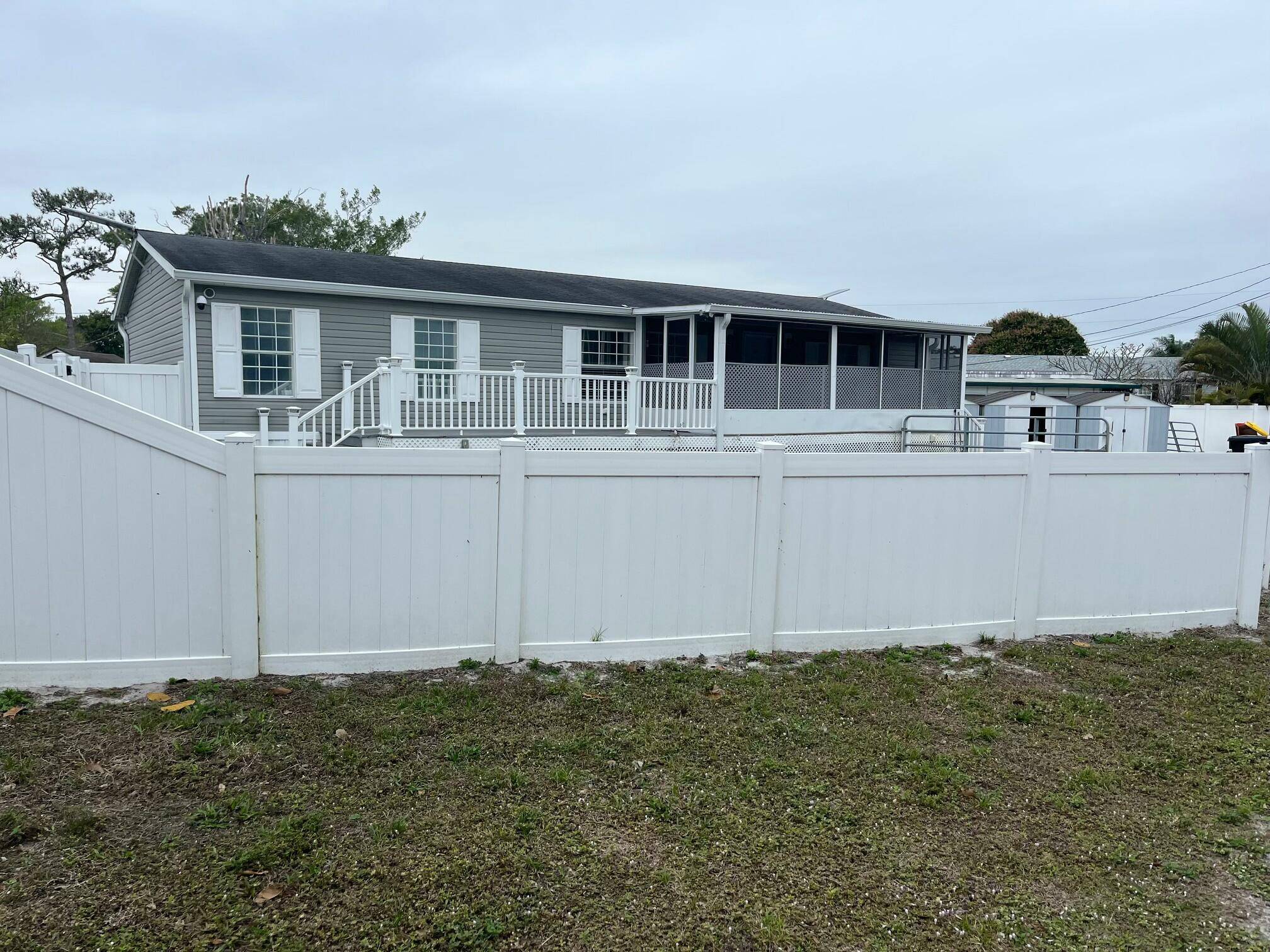 Large manufactured home on a large corner lot.
