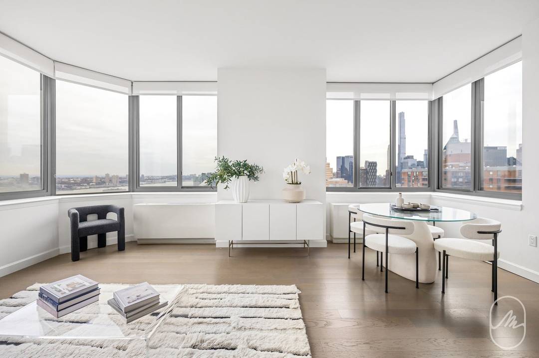 Sprawling double corner, two bedroom, two bathroom with walls of bay windows and expansive views now available.