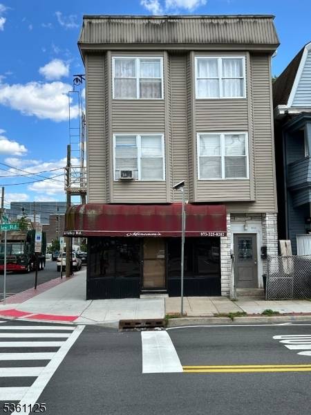 This property features a well designed multi family layout consisting of four residential units situated above a vibrant storefront.