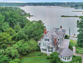 Perched high above Scott's Cove in the prestigious private Tokeneke Association, is this wonderful fully furnished WATERFRONT Home, all set for Summer Fun !