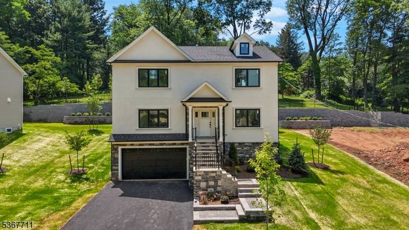 Spectacular custom new construction home in the most sought after Whispering Hills neighborhood of South Plainfield.