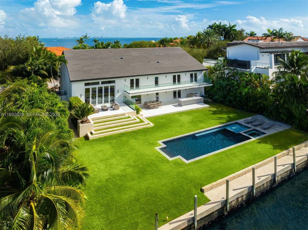Located in the gated Sunrise Harbor community, this completely renovated waterfront contemporary estate offers 7, 435 total SF on a 14, 500 SF lot with 100 feet of canal frontage ...
