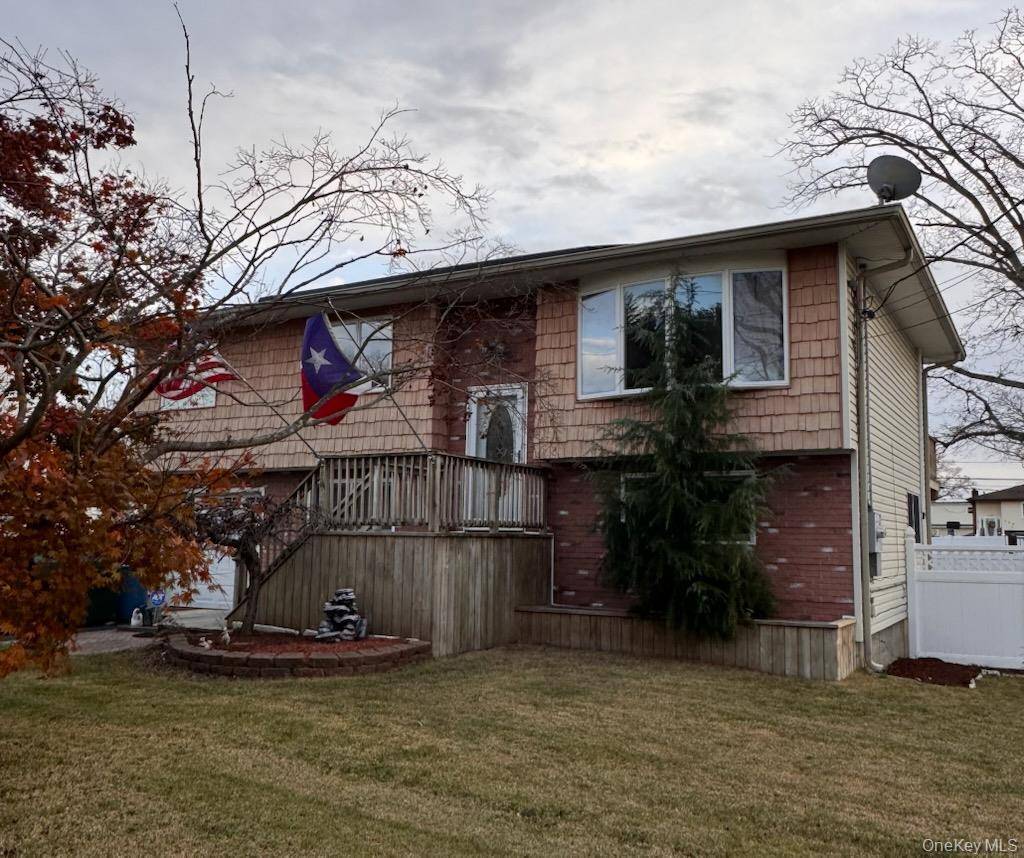 Welcome to this Beautifully Maintained Hi Ranch Home on a Quiet Street in the Heart of West Babylon.