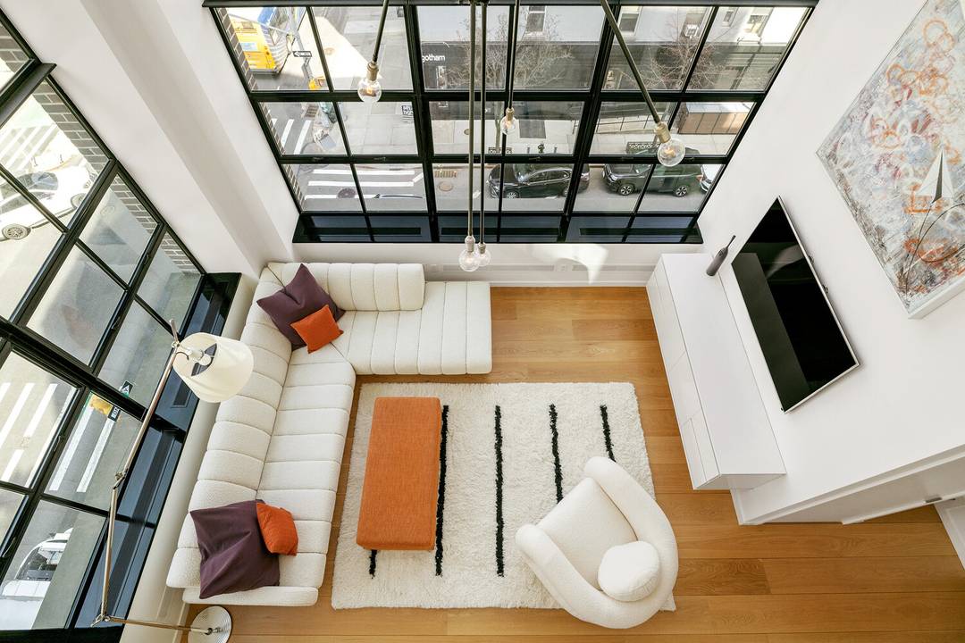 Designed by acclaimed architect Cary Tamarkin, this distinctive corner duplex loft captures the essence of Chelsea living along the High Line.
