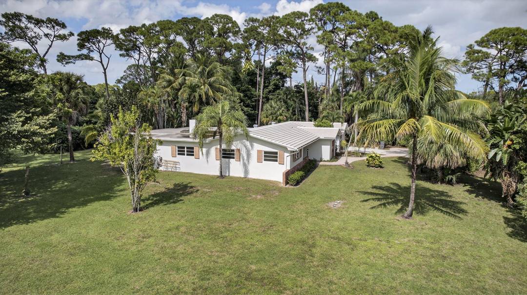 Nearly 100, 000 sq ft of land in Palm Beach Gardens NO HOA, RE Residential Estate zoning, and one of the larger and more desirable lots in all of Square ...
